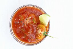 Tomato dip with wedge of lime