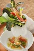 Rice paper roll filled with vegetables, noodles & herbs, chilli sauce