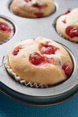 Redcurrant muffins in baking tin