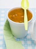 Tomato and vegetable soup in polystyrene cup