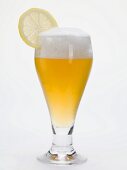Glass of shandy with slice of lemon (UK)