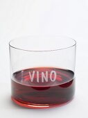 Glass of red wine with the word Vino