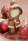 Chocolate Father Christmas, red Christmas bauble