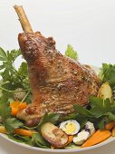 Lamb shank with quails' eggs, carrots and parsley for Easter