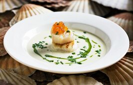 Scallop soup with salmon caviar and rocket