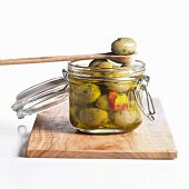 Green olives in preserving jar