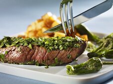 Steak coated in herbs with Pimientos de Padron