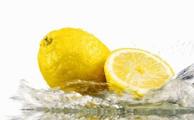 Lemons with splashing water