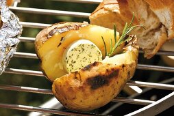 Barbecued potato with herb butter and rosemary, baguette