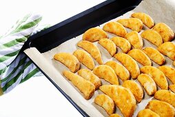 Potato wedges on baking tray