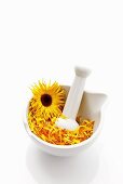 Marigolds in mortar with pestle
