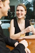 Young couple drinking white wine