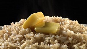 Brown rice with knobs of butter