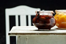 Stewed apricot and plum fruit in glass