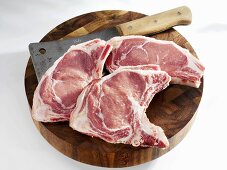 Pork Neck raw meat piece on wooden cutting board. wooden background. Top  view Stock Photo by composter-box