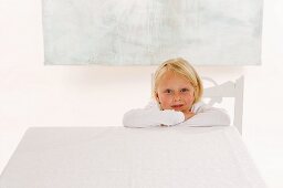 Girl sitting at empty table