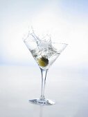 Martini with green olive (splash)