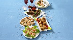 Assorted party snacks on plates