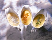 Mousseline sauce, maltaise sauce and bearnaise sauce in serving dish