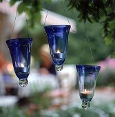 Drei blaue Glasampeln mit Teelichter 