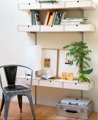 Book shelves on wall and chair on wooden floor