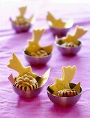 Star shaped peanut butter cookies in small pink bowl