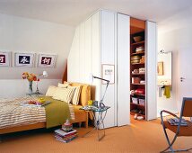 Bedroom with table, chairs, bed and wardrobe