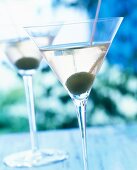 Close-up of martini cocktail with dry vermouth and gin in glass with olive