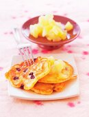 Close-up of pancakes with apple and pears on plate