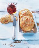 Macadamia rolls sprinkled with sugar in bowl