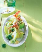 Shrimp salad with melon on plate