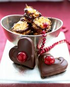 Heart shaped honey stuffed chocolates and florentine in silver bowl