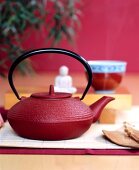Close-up of red cast iron teapot