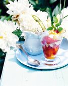 Asparagus and strawberry dessert with vanilla cream in glass