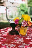 Lantern and flowers with folded decorating tips in glass