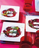 Three plates of beetroot carpaccio with soft cheese and rocket leaves