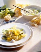 Ribbon pasta with saffron sauce on plate and ribbon pasta with lime sauce in bowl