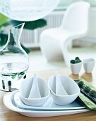 White porcelain with cocoon shape jar on table