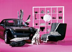 Room with car, sofa, dog, floor lamp, cushions and shelf against pink background