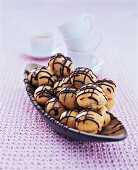 Mocha profiteroles on serving dish