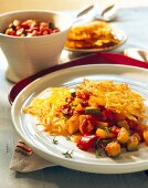 Hash browns with peppers on plate