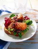 Close-up of salmon with salad on plate