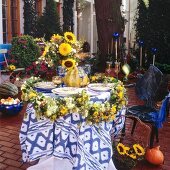Sunflower decoration on laid table at garden terrace