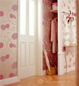 Room with floral wallpaper and wall cabinet