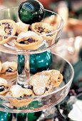 Close up of mince pies with cranberries in a glass stand