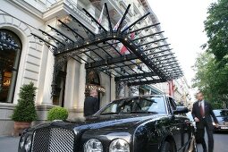 View of car parked at the entrance of Grand Hotel in Vienna, Austria