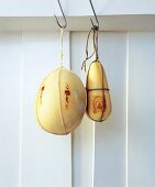 Cheese wrapped in cloth and hanging on hooks in Campania, Southern Italy