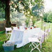 A table laid with flowers in a garden