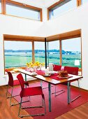 Laid table and interior with glass window in dining area