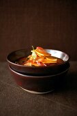 Stack of Asian turnip on soup in bowl